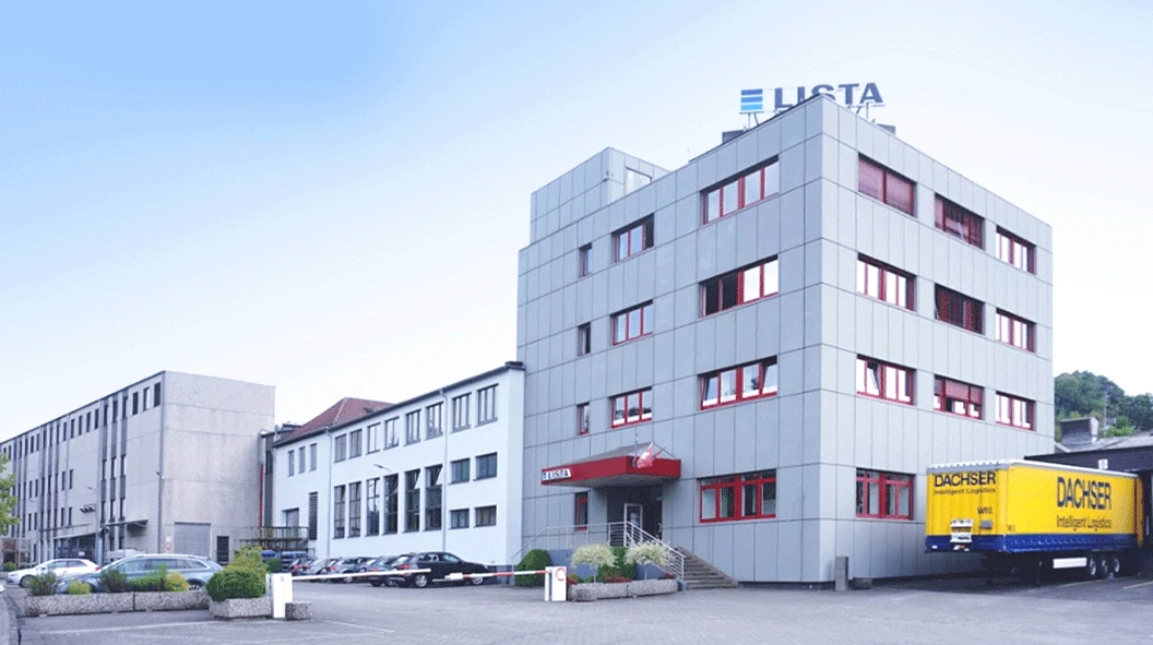 WORKPRO industrial building in Germany with LISTA signage, a tall office block and a delivery truck outside WORKPRO industrial building in Germany with LISTA signage, a tall office block and a delivery truck outside