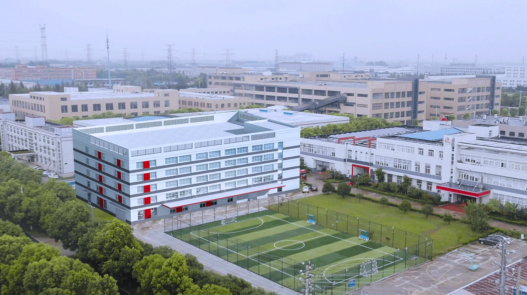 WORKPRO laser facility in China with a multistory office building, surrounding factory blocks and a sports court WORKPRO laser facility in China with a multistory office building, surrounding factory blocks and a sports court
